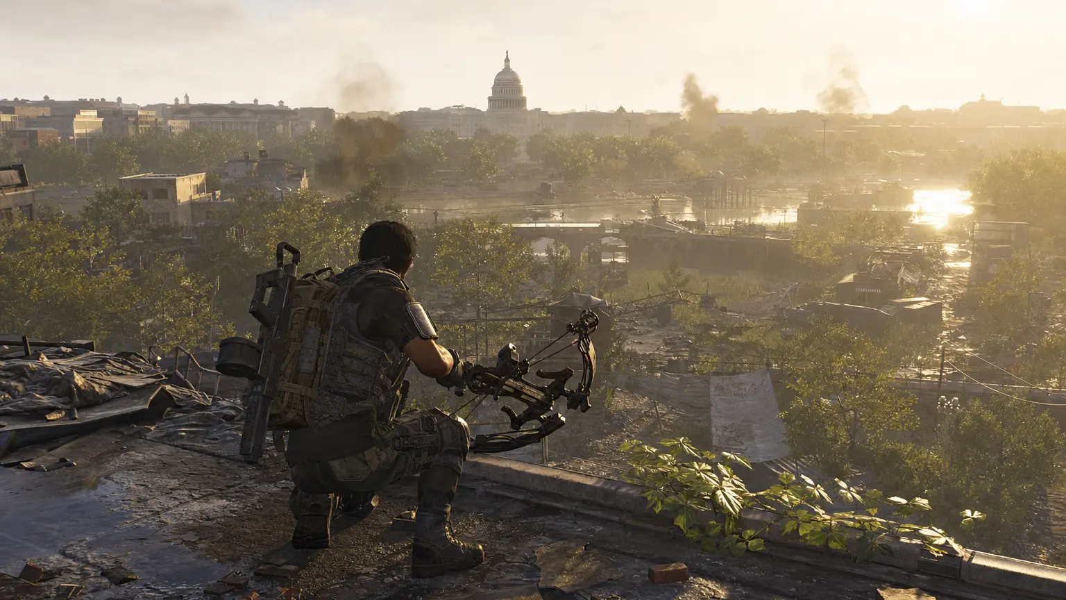 A Division 2 agent with a heavy signature weapon (a large crossbow) kneels on a rooftop overlooking the ruined Washington D.C. skyline with