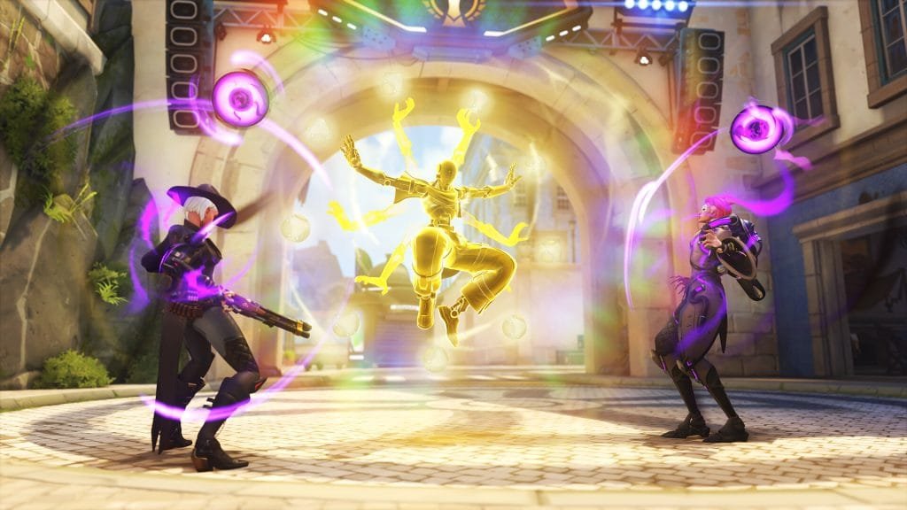 Ashe, Zenyatta, and Moira using their abilities during an Overwatch team fight.